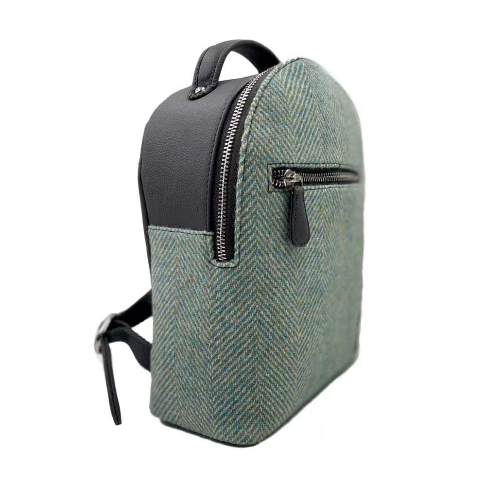 Harris tweed backpack with a turquoise herringbone pattern.