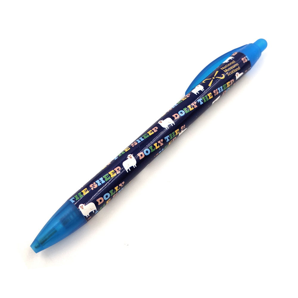 A blue plastic ballpoint pen with a pattern with illustrations of Dolly the sheep against a plain white background.