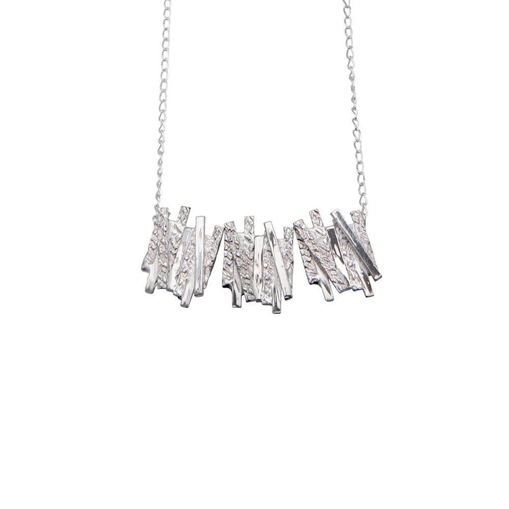 Silver Pendant with geometric overlapping line detailing.