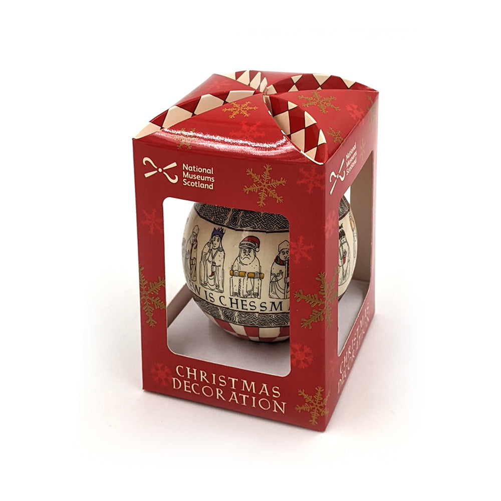 Lewis Chess Piece Christmas Bauble in a red box decorated with snowflakes.