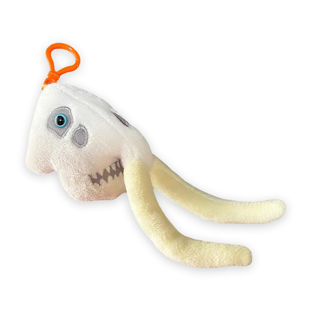 a plush keyring of a mammoth skull on an orange clip against a plain white background