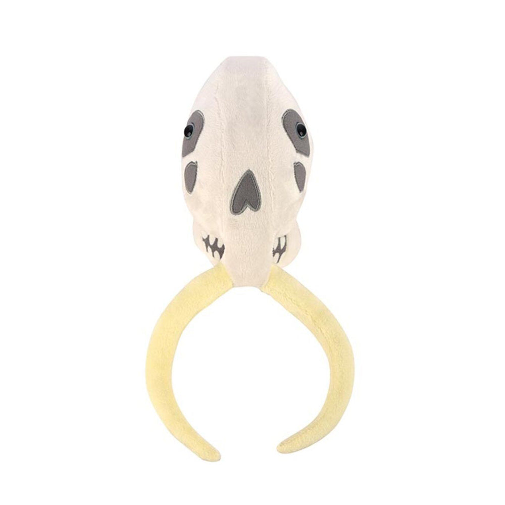 A front on view of a plush soft toy of a mammoth skull against a plain white background.