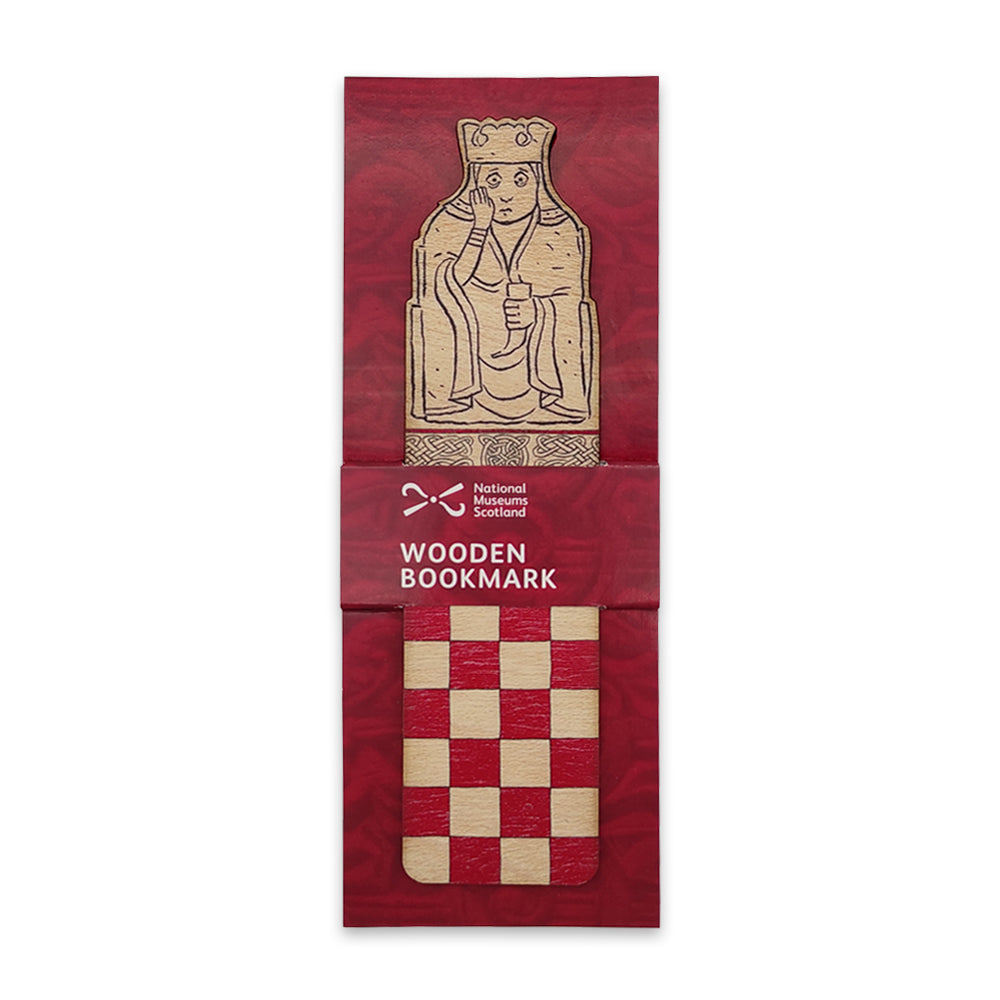 A wooden bookmark with the top half illustrated with a queen Lewis chess piece and the bottom half with a red chessboard style grid on a maroon backing card.