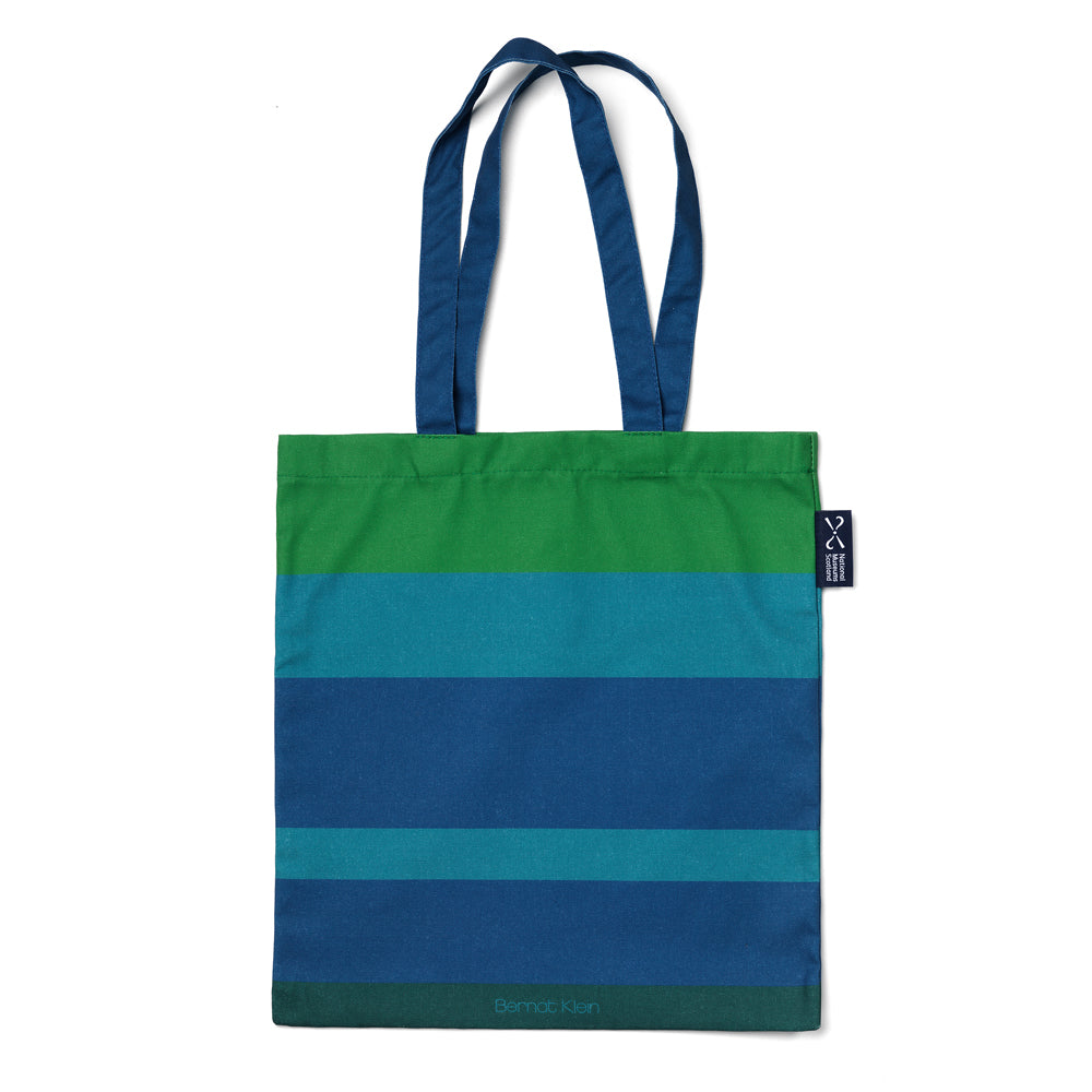 A blue and green striped cotton shopping bag based on Bernat Klein's work against a plain white background.