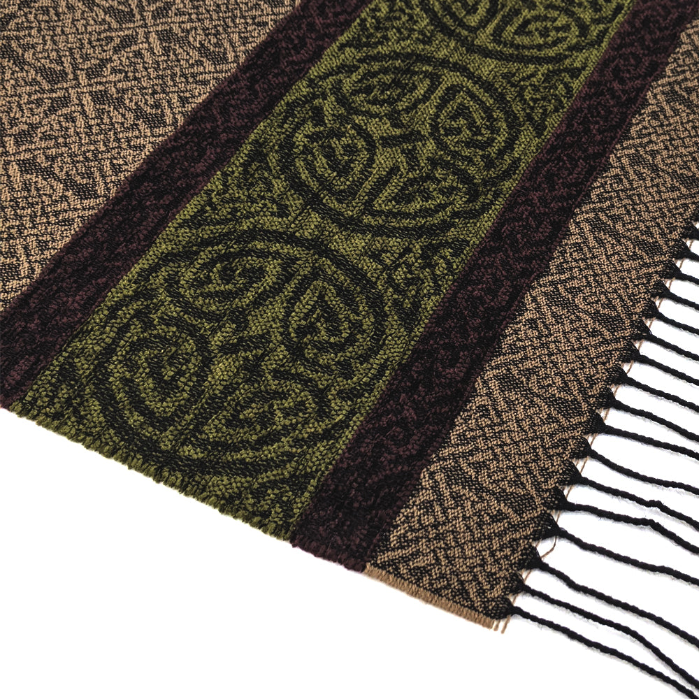 Brown and green tassled scarf detail with a celtic roundal pattern against a plain white background.