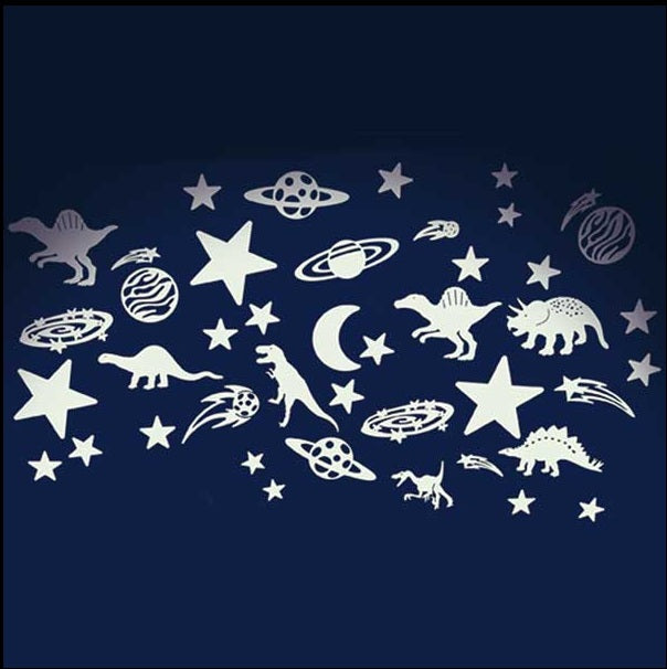 A selection of glow in the dark dinosaurs and stars against a plain navy blue background.