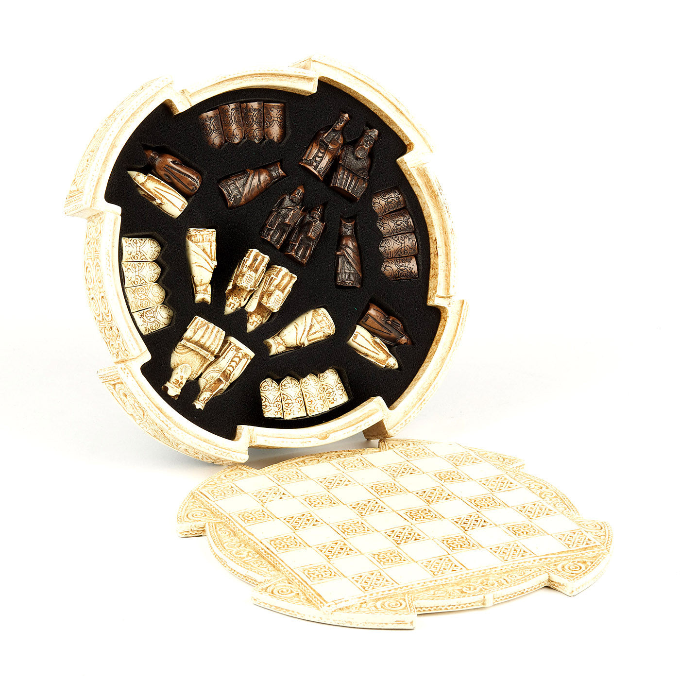 An upright rounded cream resin box, inside a foam insert which houses a brown and a white set of Lewis chess pieces. In front of the box lays a round resin lid with a chess board incorporated. The box and the lid are both decorated with knot work patterns.