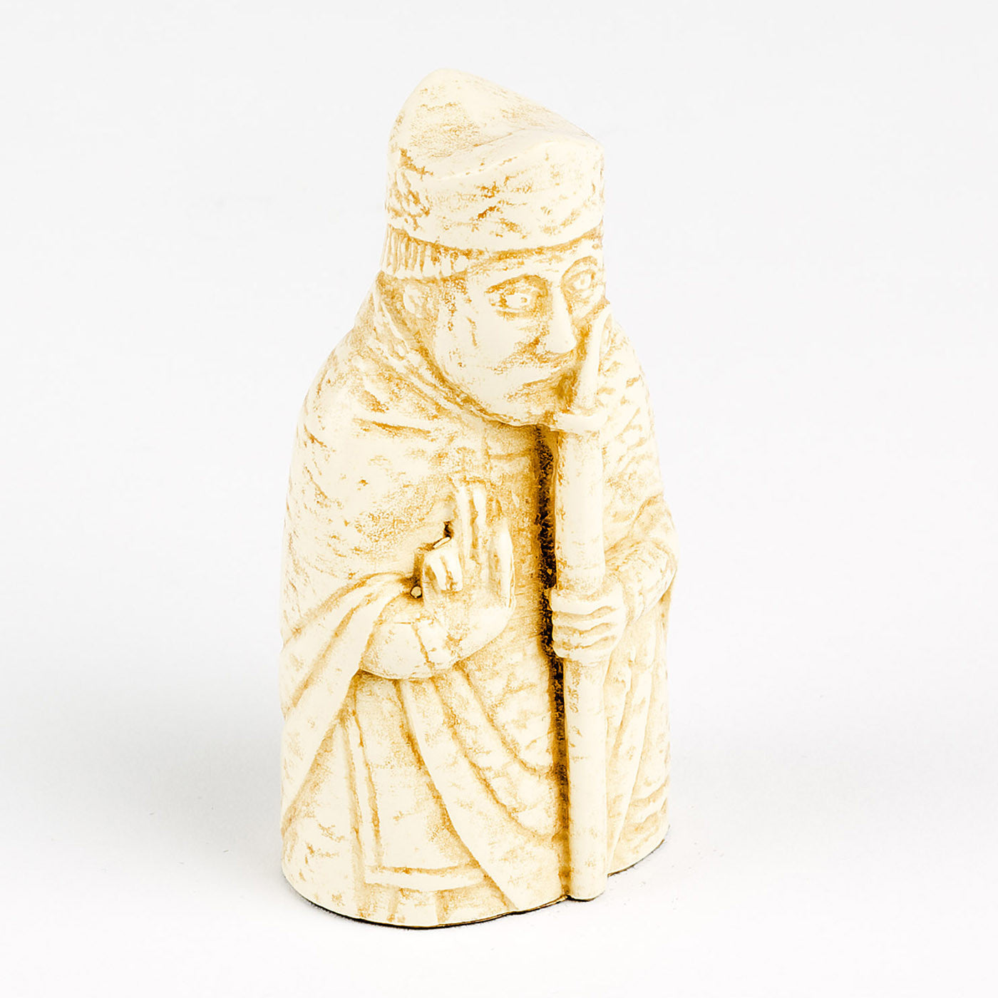 A resin replica of a bishop Lewis chess piece. The bishop is wearing long robes and his right hand is raised and he is holding a long crook in his left.