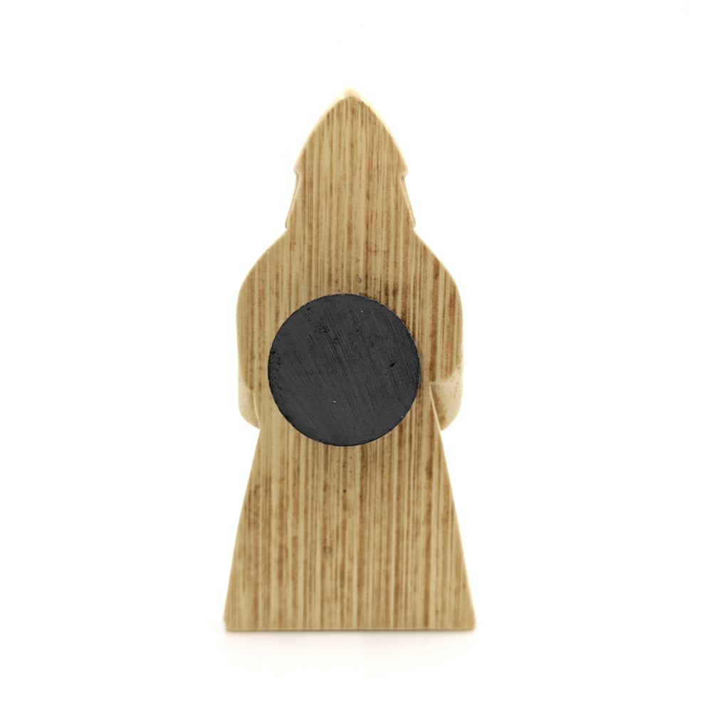 A plastic resin replica magnet of a berserker Lewis chess piece. A reverse view with the berserker cut in half with a round magnet attached to the back.