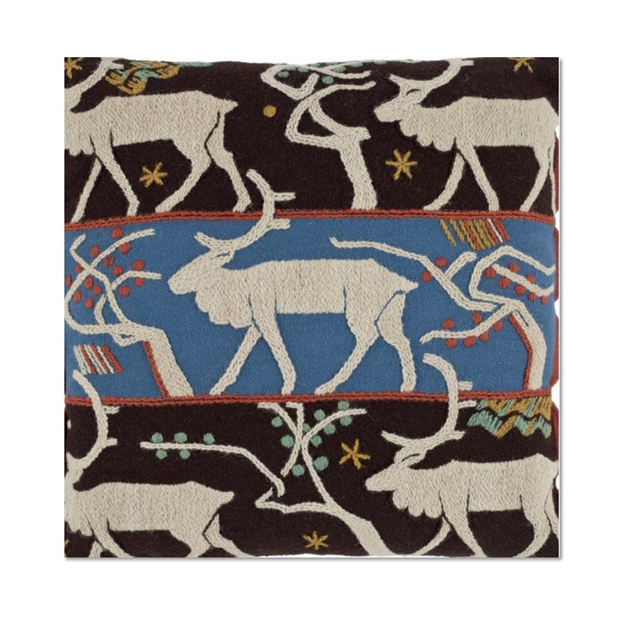 A square Christmas card with a photograph of a woolen material cushion embroidered with coloured woolen threads in satin and stem stitch and showing reindeer and trees on three bands.