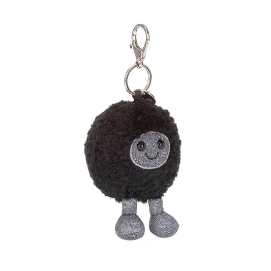 Black round plush keychain with a smiling face and grey legs on a white background