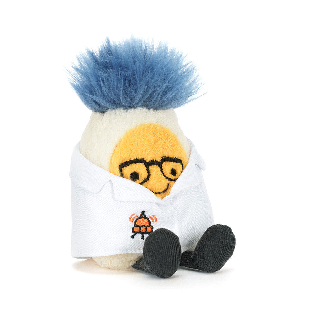 Stuffed toy resembling a scientist with blue hair, glasses and a white lab coat on a white background