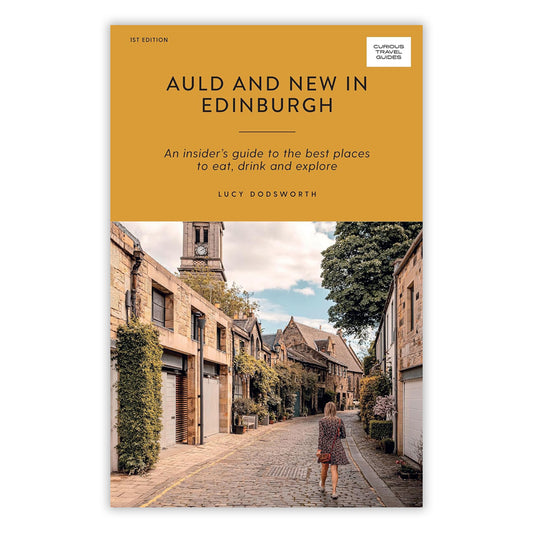 Book cover with photo of Circus Lane in Edinburgh. The top half of the book has black text against a plain mustard coloured background.