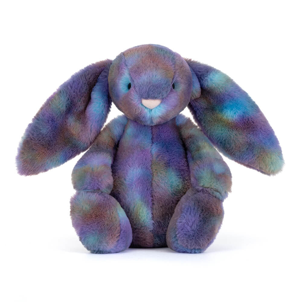 Multicoloured plush bunny toy in space inspired colours on a white background