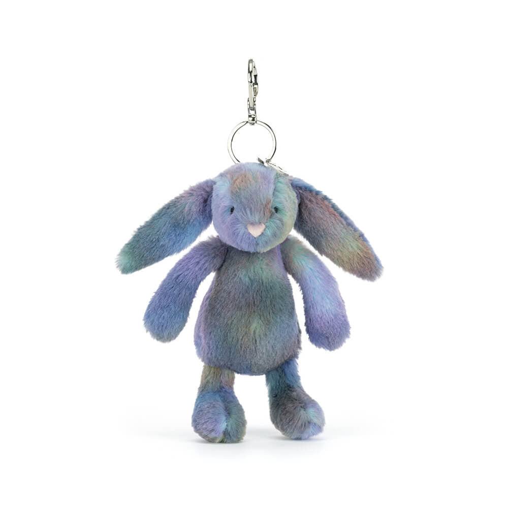 Plush bunny keychain with pastel space inspired colours on a white background.