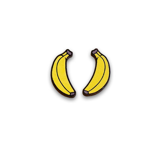 Two wooden cartoon yellow banana earrings against a plain white background