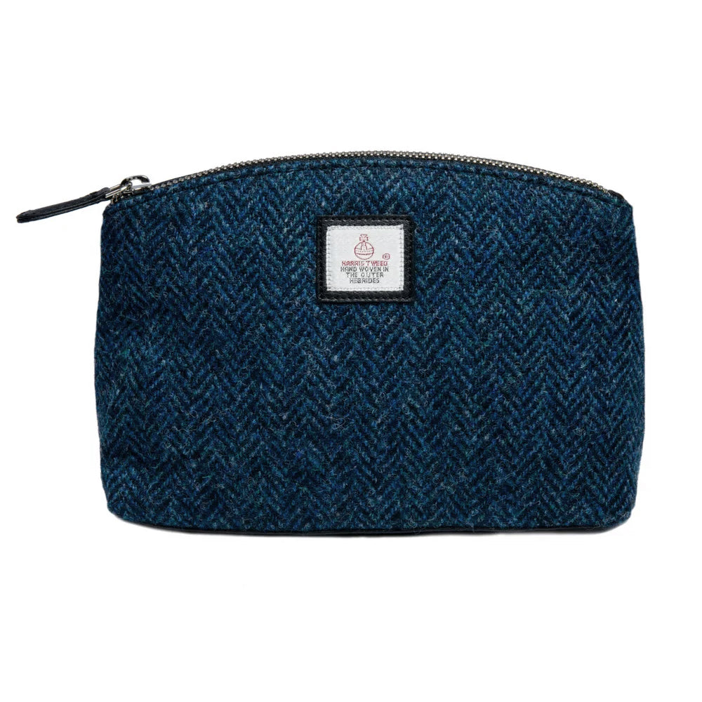 Blue Harris tweed cosmetic bag with a black vegan leather zipper.
