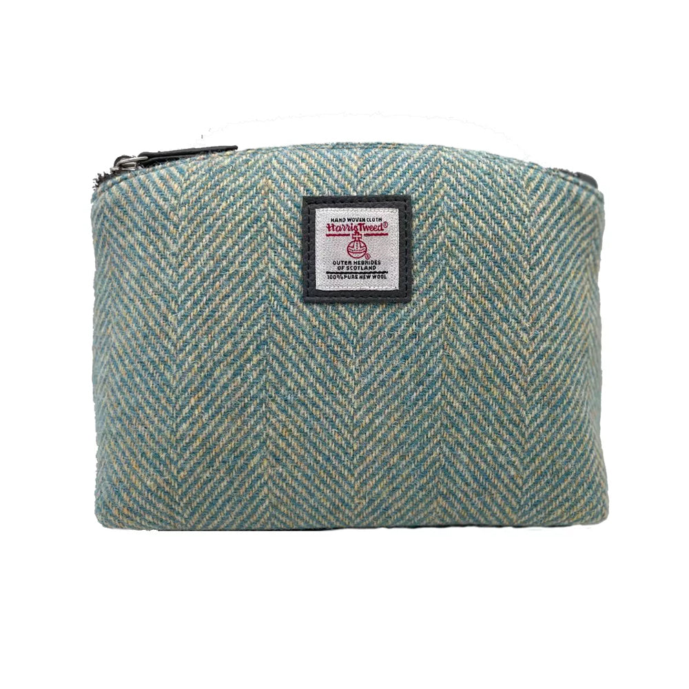 Turquoise herringbone Harris tweed cosmetic bag with a grey vegan leather zipper.