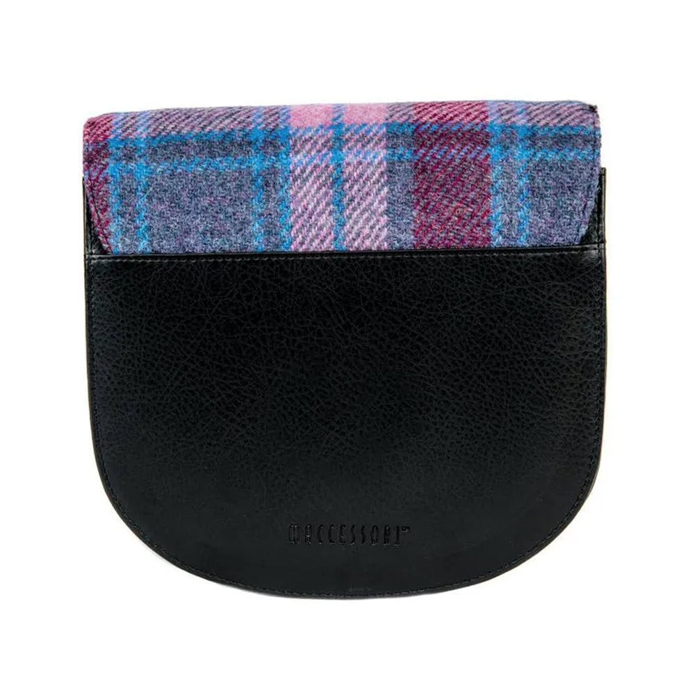 Reverse of a pink checked Harris tweed bag with black vegan leather detailing.