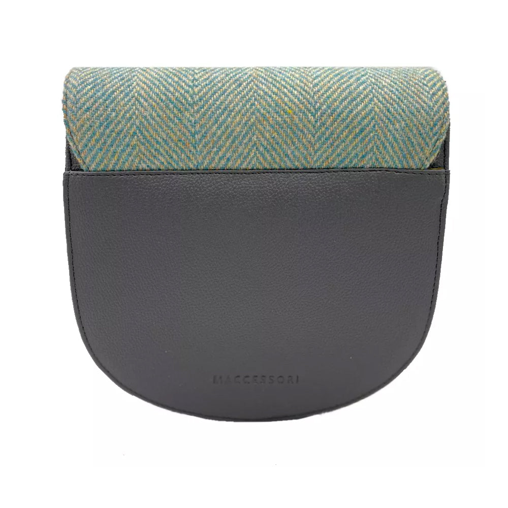 Reverse of a turquoise herringbone Harris tweed bag with grey vegan leather detailing.