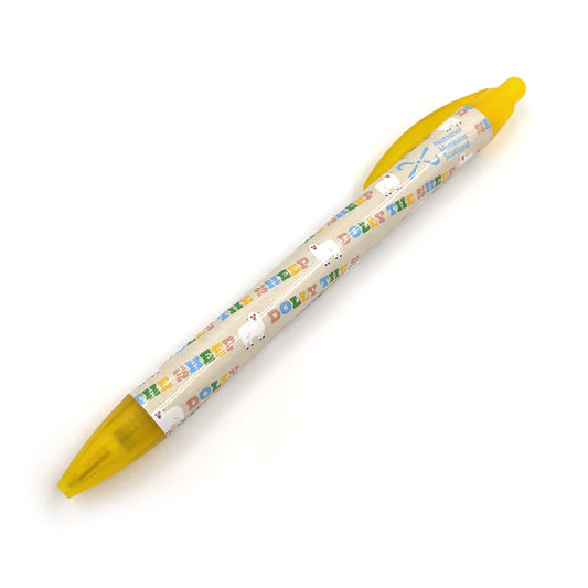 A yellow plastic ballpoint pen with a pattern with illustrations of Dolly the sheep against a plain white background.