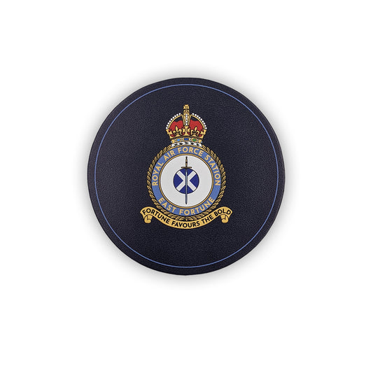 A round navy leather coaster with the East Fortune Royal Air Force badge. A sword lays over a Saltire flag which sits in the centre of a round crest topped by a royal crown.