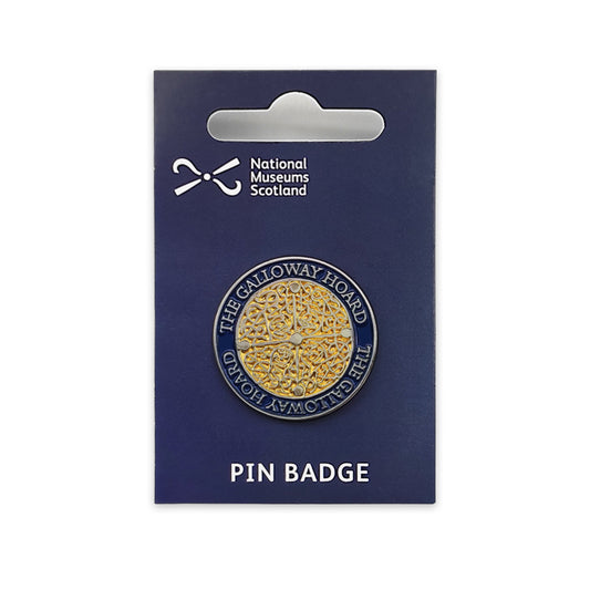 A round gold and blue pin badge on a navy blue backing card against a plain white background