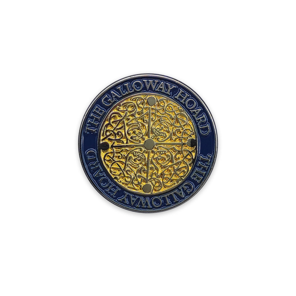 a round gold and blue pin badge against a plain white background