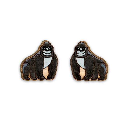 Two wooden cartoon gorillas against a plain white background. The gorillas are facing inwards to each other and painted in grey and black.
