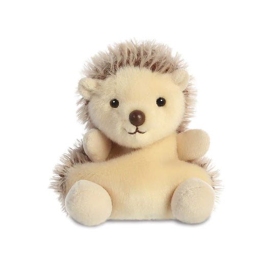 A small brown hedgehog soft toy with black beaded eyes and a brown plastic nose sitting against a plain white background.