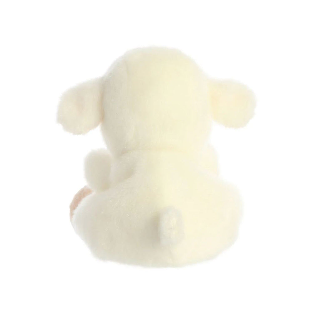 A reverse view of a small white and pink lamb soft toy with black bead eyes sitting against a plain white background.