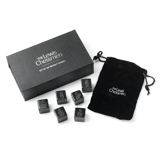 A black box embossed with the words "The Lewis Chessmen" in metallic silver, a black drawstring bag and six rounded stone cubes etched with illustrations of Lewis chess pieces.