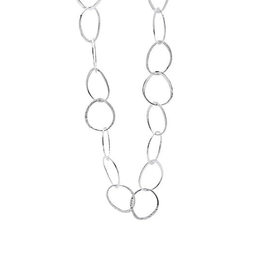 Silver necklace of large intertwining rings.