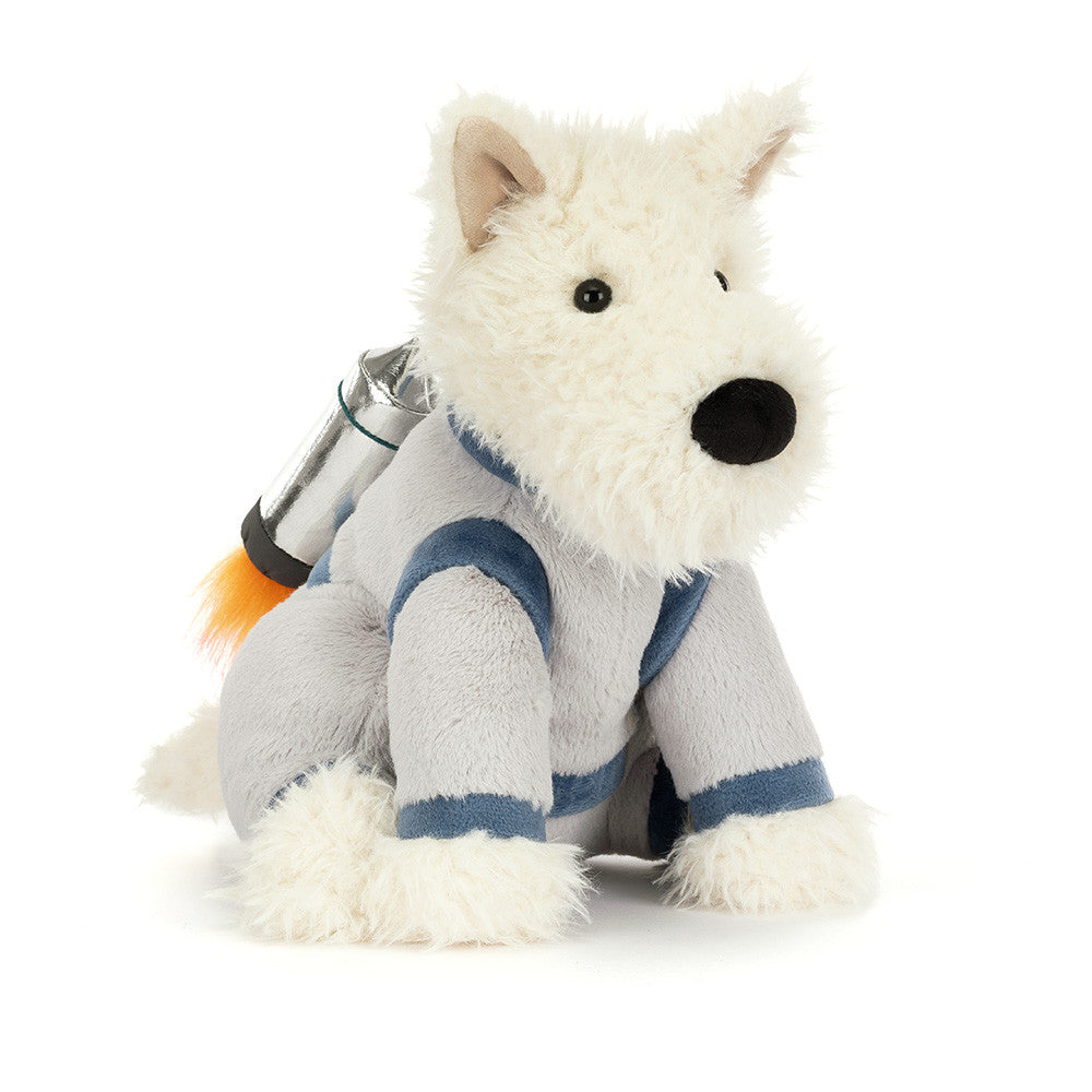 A plush white Scottie dog in a grey space suit with a shiny silver jetpack with fluffy orange flames against a white background.