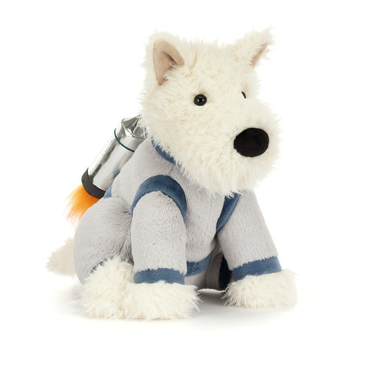 A plush white Scottie dog in a grey space suit with a shiny silver jetpack with fluffy orange flames against a white background.