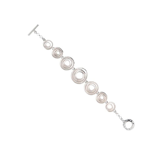 Silver bracelet with rose like detailing.