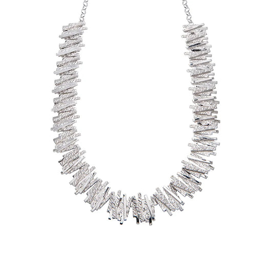 Silver necklace with geometric overlapping line detailing.