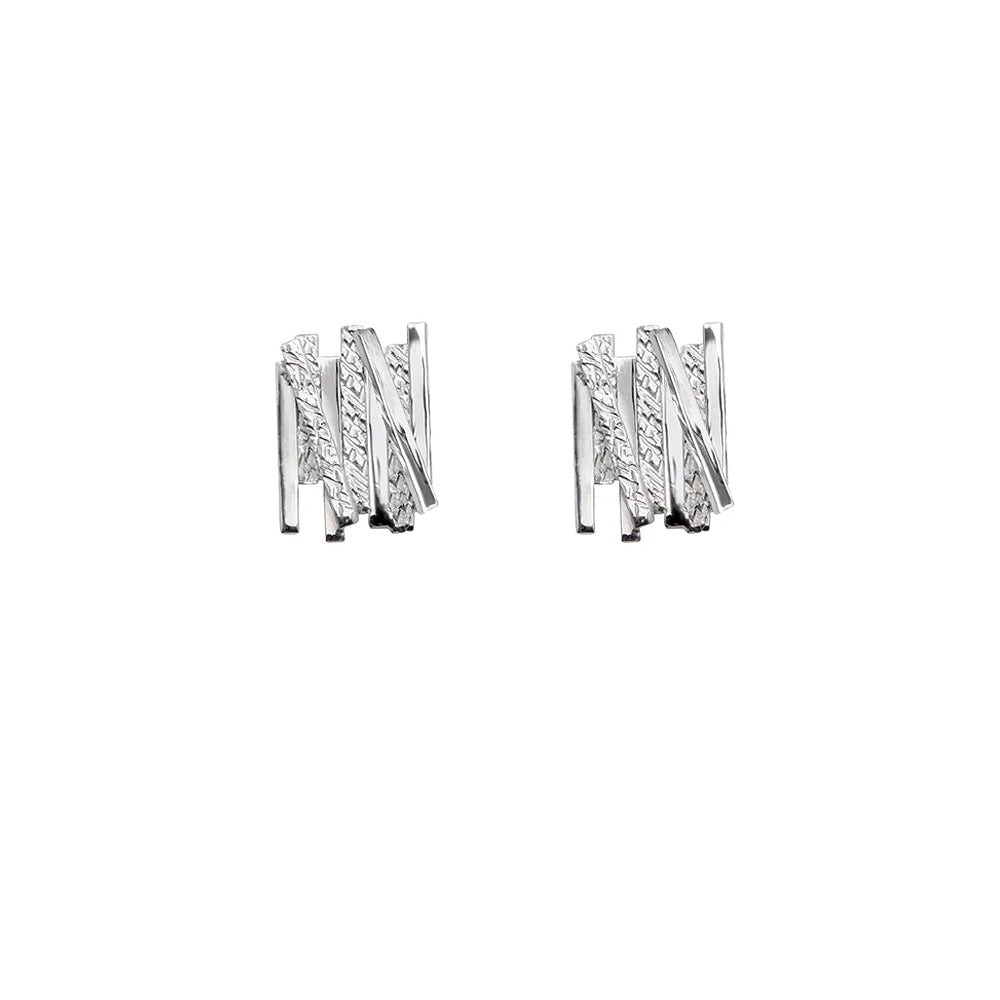 Silver earrings with geometric overlapping line detailing.