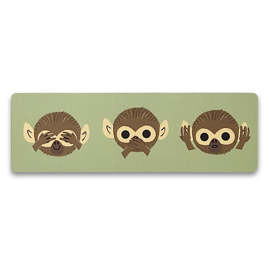 A paper bookmark with an illustration of three monkey faces against a pale green background. From left to right one is covering its eyes, one is covering its mouth and one is covering its ears. 
