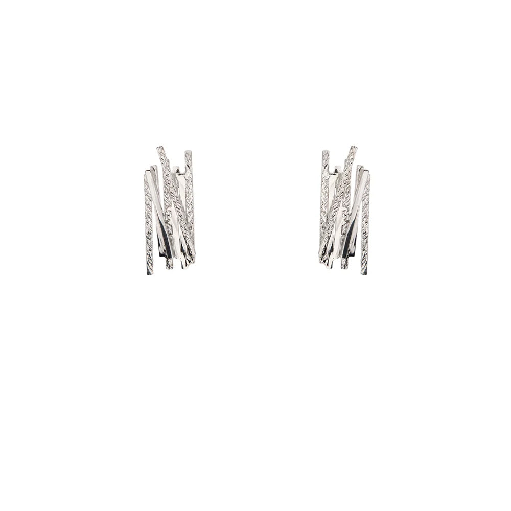 Silver earrings with geometric overlapping line detailing.