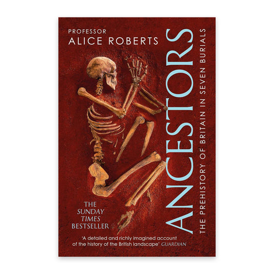 A book cover against a plain white background with a photograph of a skeleton half buried in red sand. The book title is written vertically along the pages edge. in a pale blue font.