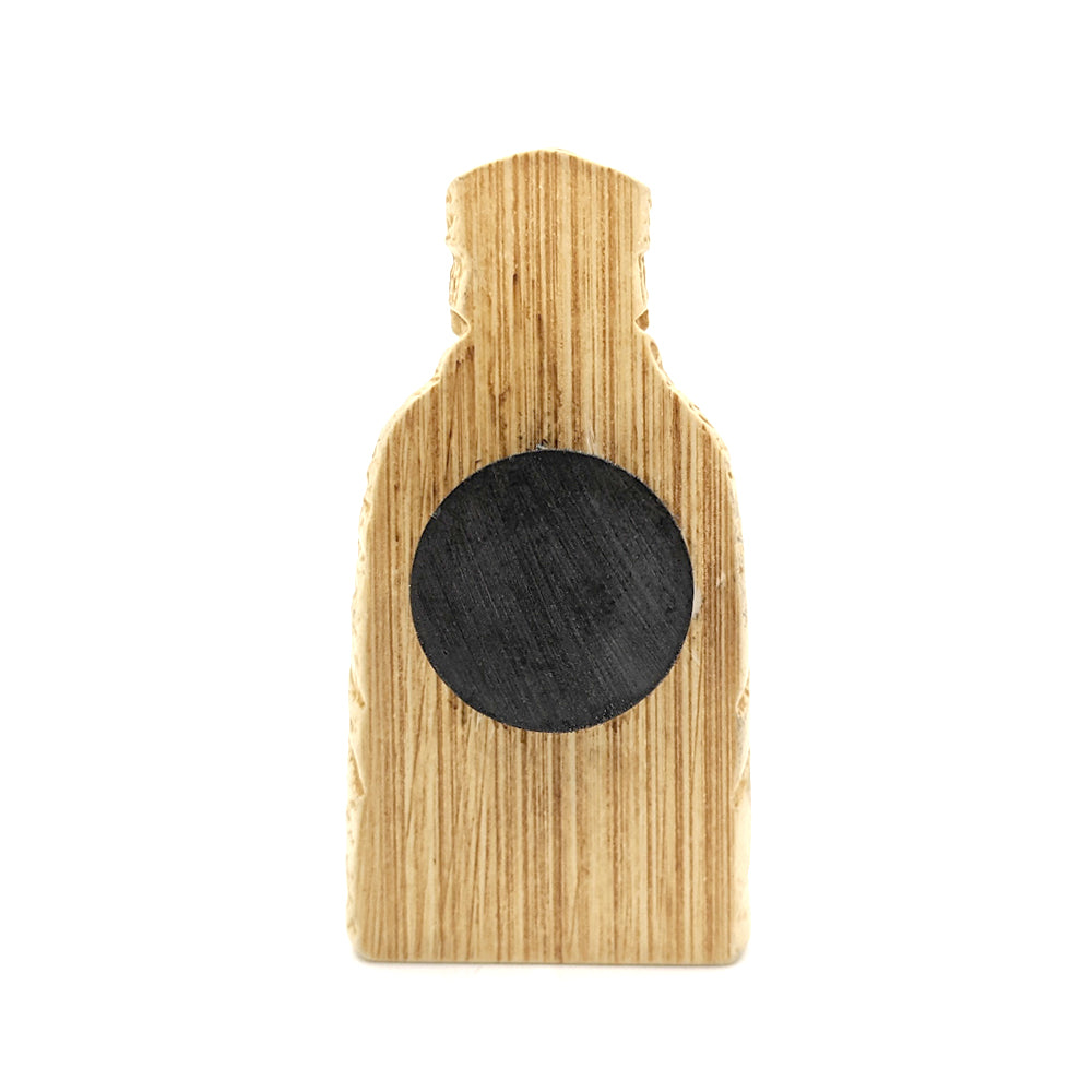 A plastic resin replica magnet of a bishop Lewis chess piece. A reverse view with the bishop cut in half with a round magnet attached to the back.