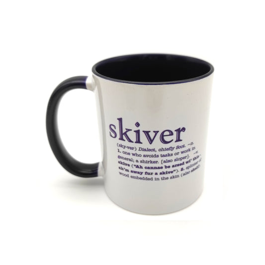 A white mug with a black inside and handle against a plain white background. The mug is printed with the word skiver and its definition in black.