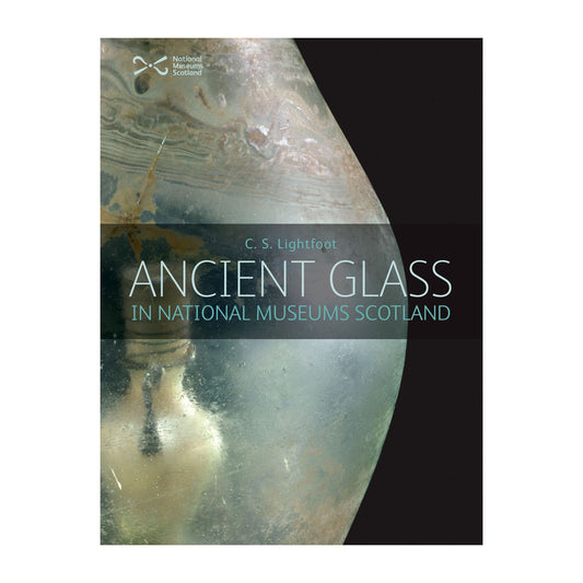 Book cover with a close up of ancient frosted glass work to the left hand side against a black background.