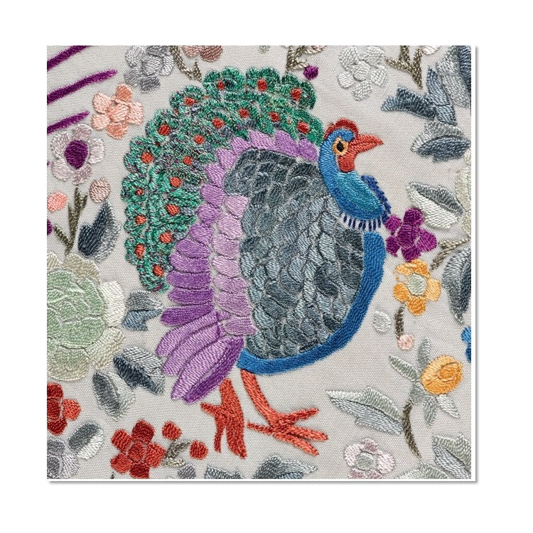 A square Christmas card with an embroidered detail of a turkey from a 19th century Chinese shawl. The turkey is embroidered in blues, purples, greens, and oranges and is surrounded by floral details.