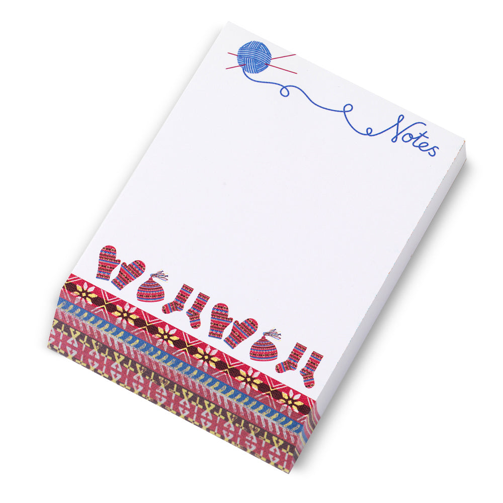 A notepad block with a knitted fair isle inspired illustrated design against a plain white background.