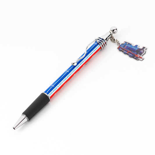 A metal pen with a charm of a train and a red and blue pattern of the forth bridge, the forth road bridge and the queensferry crossing against a plain white background.