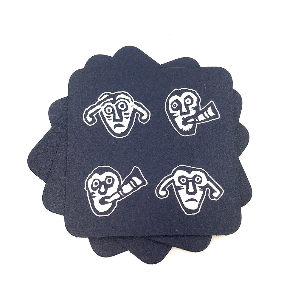 Square blue leather coasters with silver faces taken from a detail of a brooch from the Galloway hoard.