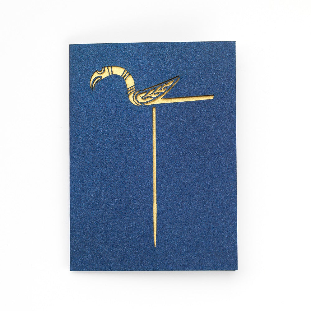 A greetings card with a cutout detail of the Galloway hoard gold bird pin on navy blue card with gold card revealed underneath.