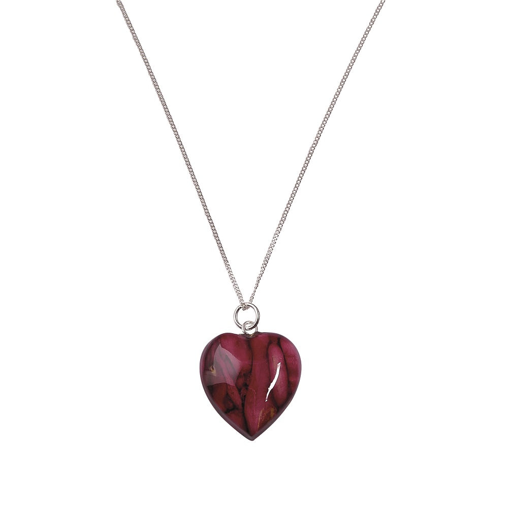 A purple heart pendant on a silver chain against a plain white background.